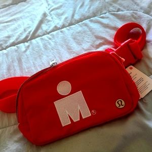 Lululemon Everywhere Belt Bag with Ironman symbol.